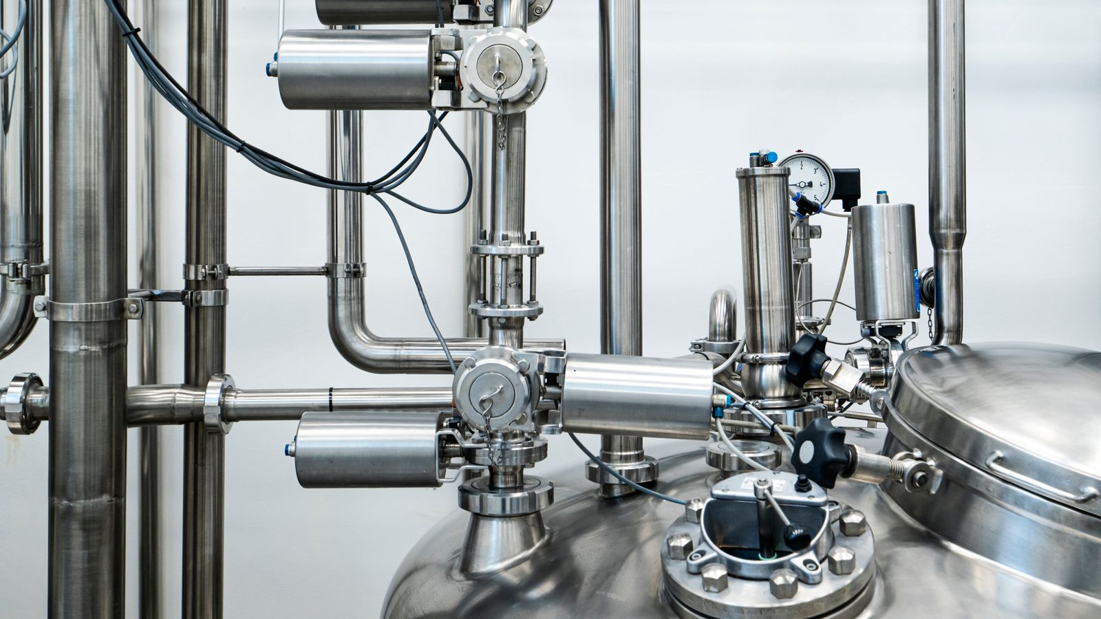 Stainless steel process piping and pressure vessel in an industrial plant — nuclear-grade abrasives guide, Whitby Abrasives, Ontario