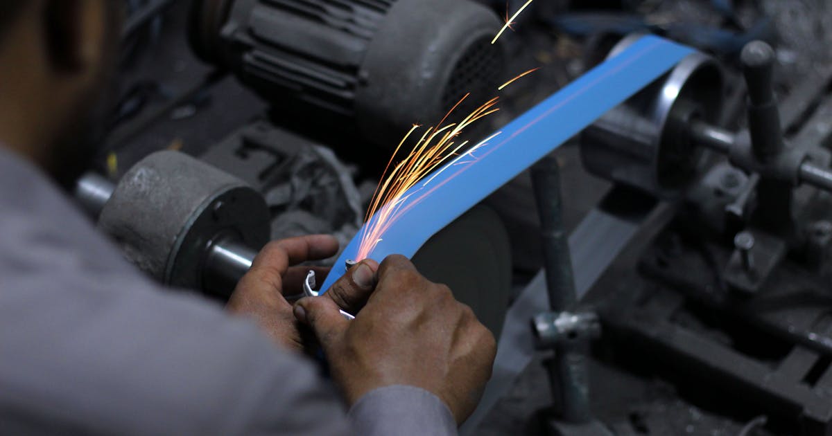 Sanding and finishing a metal surface — Whitby Abrasives sanding belts and discs, Ontario