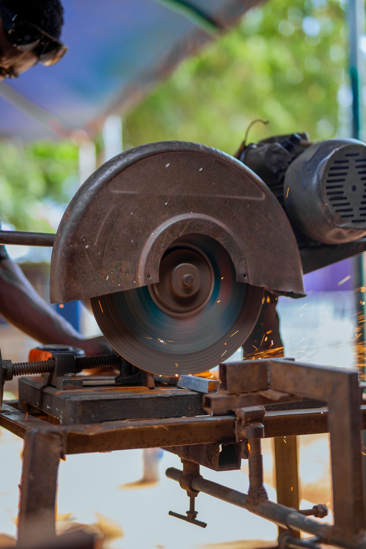 Industrial metal cutting with sparks flying in a fabrication plant — Canadian abrasives market