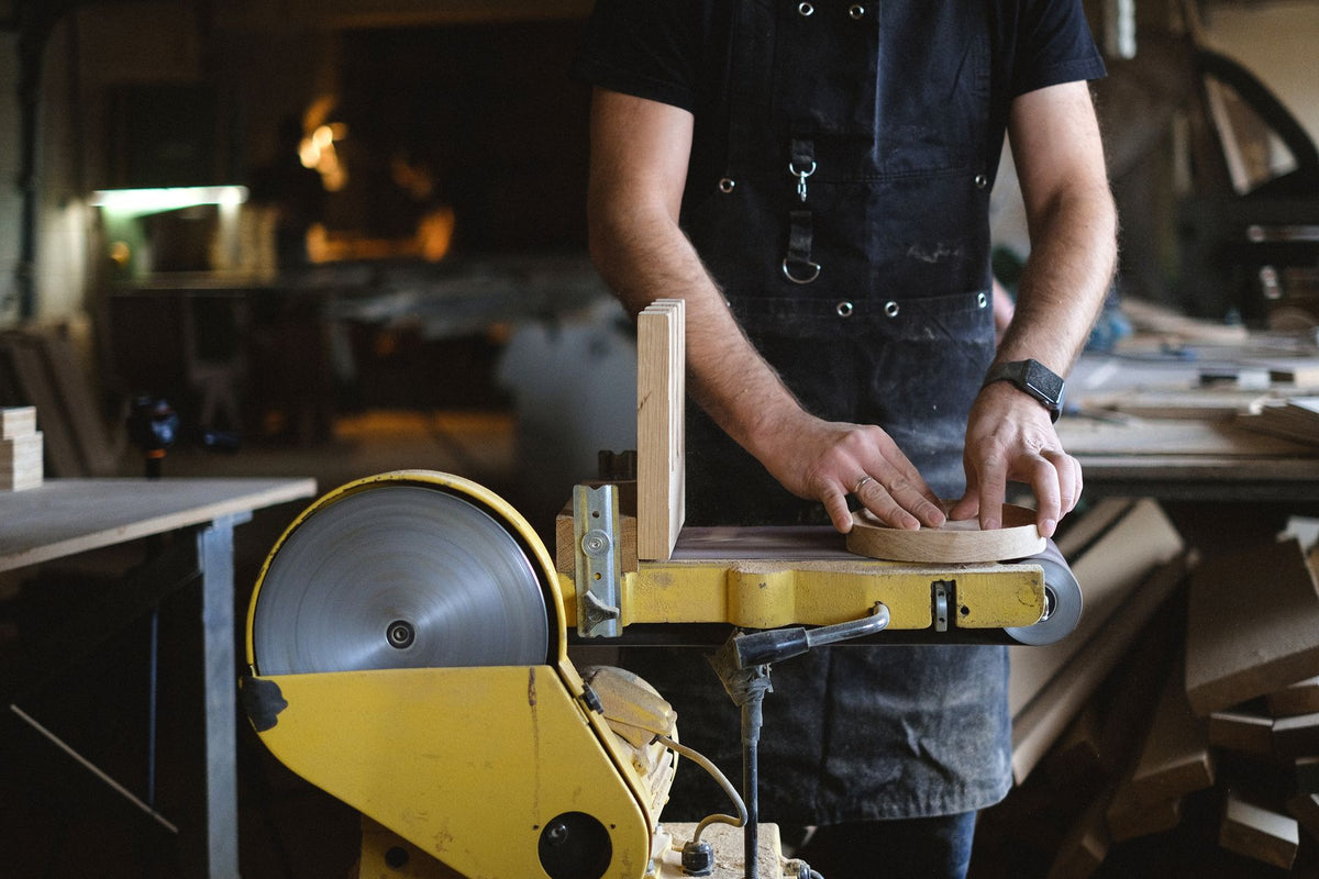 Sanding belt mounted on a belt sander in a workshop